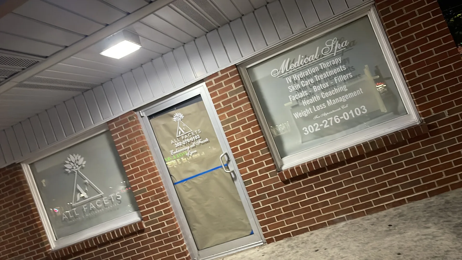 Storefront branding and window graphics for All Facets in Delaware