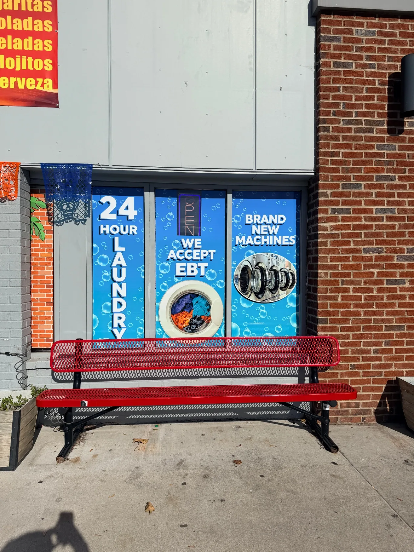 Custom window vinyl graphics for a laundry business in Delaware